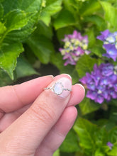 Load image into Gallery viewer, Close-up of sterling silver ring featuring a glowing rainbow moonstone cabochon