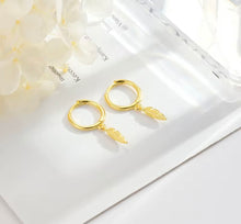 Load image into Gallery viewer, Gold plated sterling silver feather huggie earrings