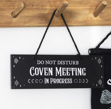 Load image into Gallery viewer, Witchy décor scene featuring Coven Meeting in Progress sign on wall