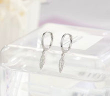 Load image into Gallery viewer, sterling silver feather huggie earrings