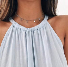 Load image into Gallery viewer, Woman wearing silver star charm choker necklace, celestial dainty jewelry for layering
