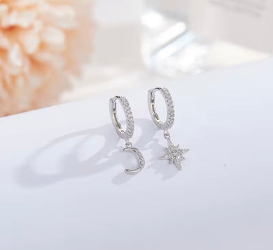sterling silver crystal mismatched moon and star huggie earrings