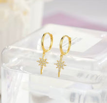 Load image into Gallery viewer, Huggie earrings gold-plated sterling silver with a North Star crystal charm
