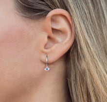 Load image into Gallery viewer, Woman wearing evil eye Huggie earrings
