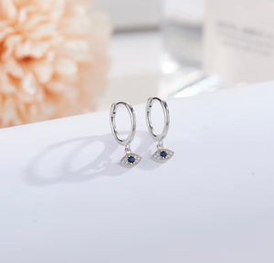 sterling silver Huggies with crystal evil eye charm