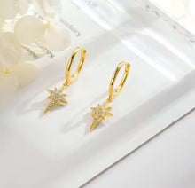 Load image into Gallery viewer, Huggie earrings gold-plated sterling silver with a North Star crystal charm
