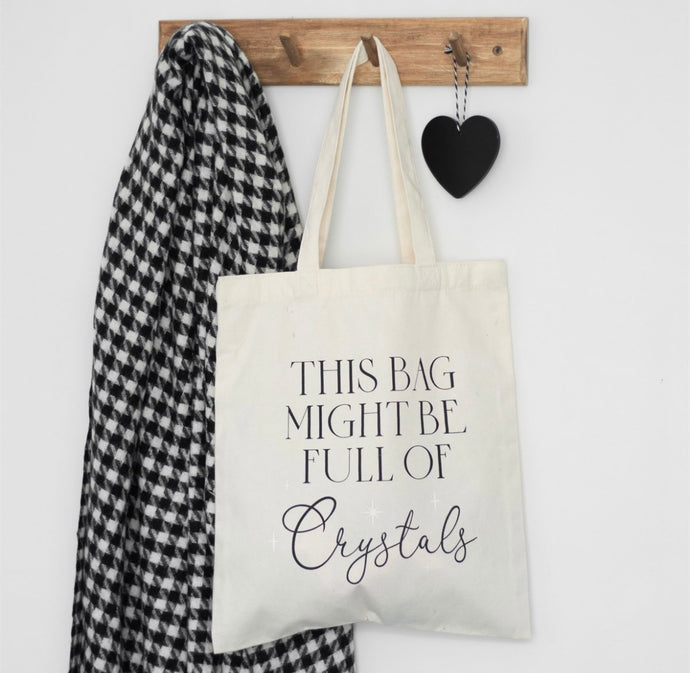 Full of Crystals polcotton tote bag with ‘This Bag Might Be Full of Crystals’ slogan on white canvas