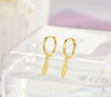 Load image into Gallery viewer, Gold plated sterling silver feather huggie earrings
