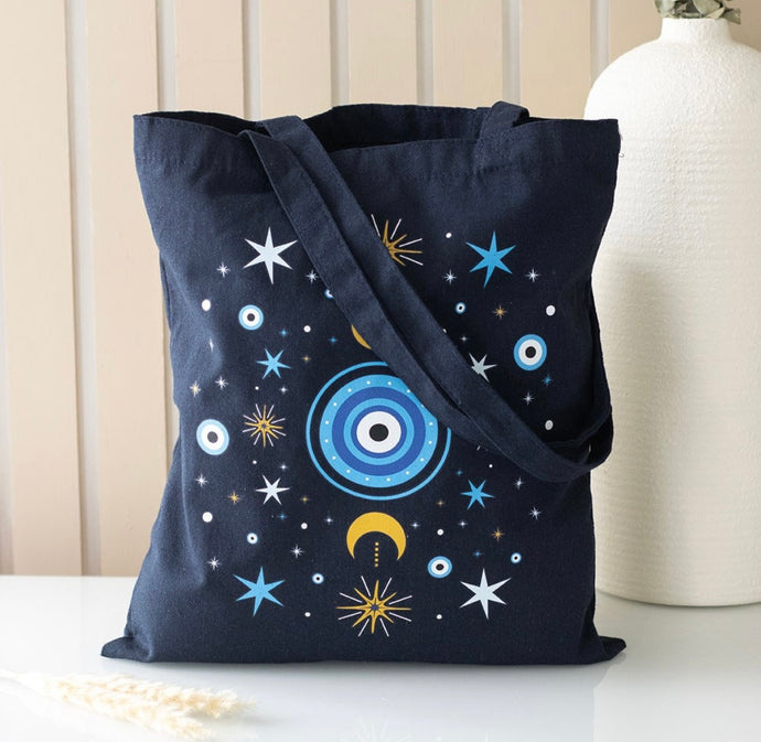 Dark blue All Seeing Eye tote bag with crescent moon and star print